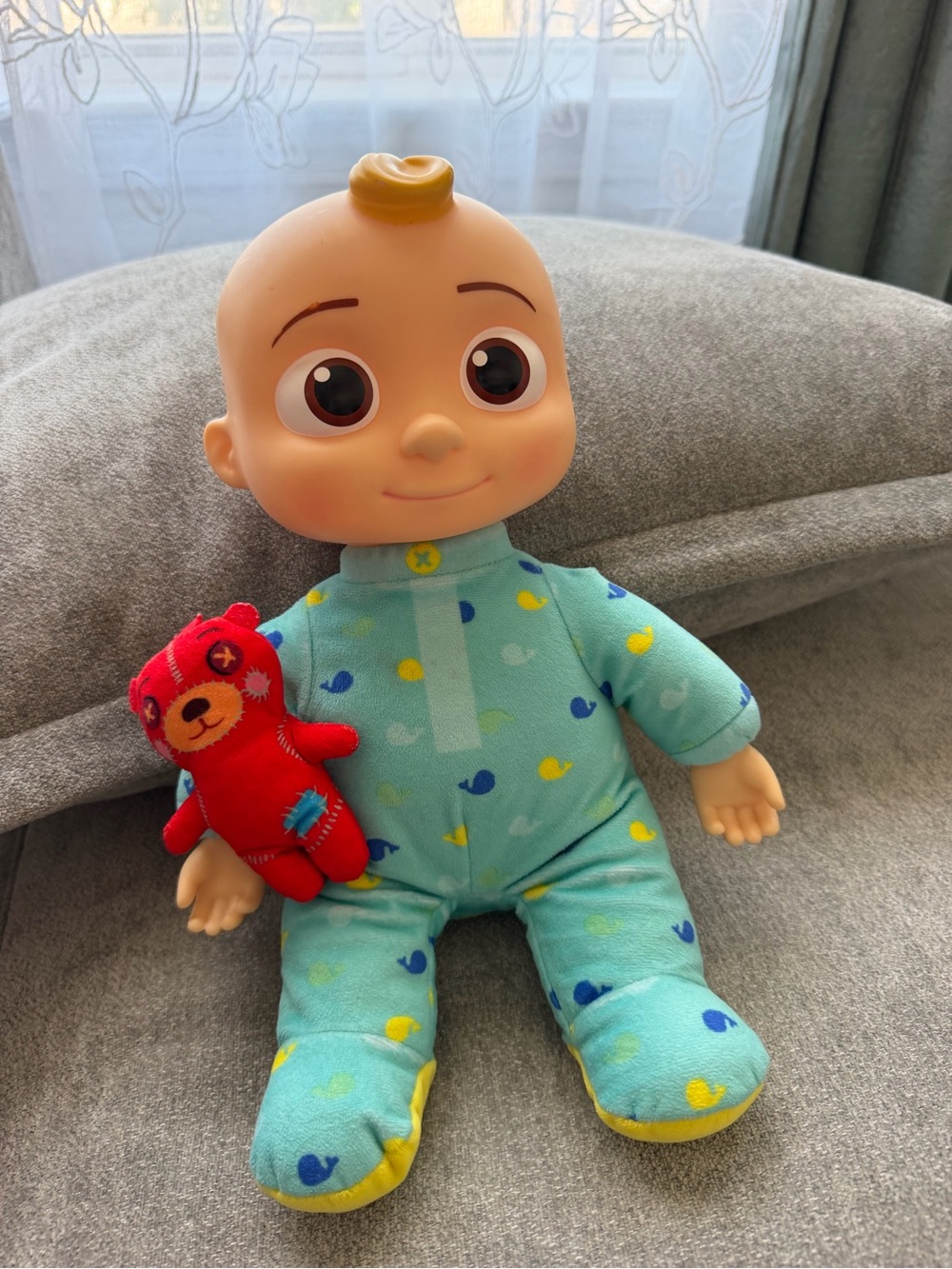 Cocomelon baby doll with blue/yellow duck pattern